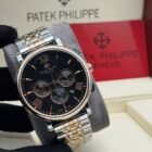 Patek Philippie chronograph watch with elegant chain strap, featuring silver case and black dial