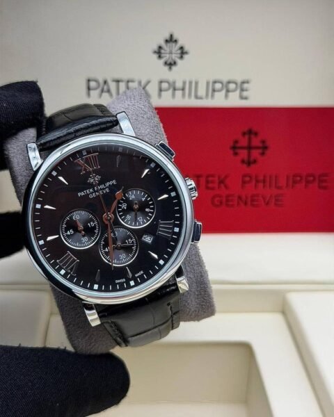 Patek Philippie chronograph watch with leather strap, sleek silver case, and black dial featuring chronograph subdials