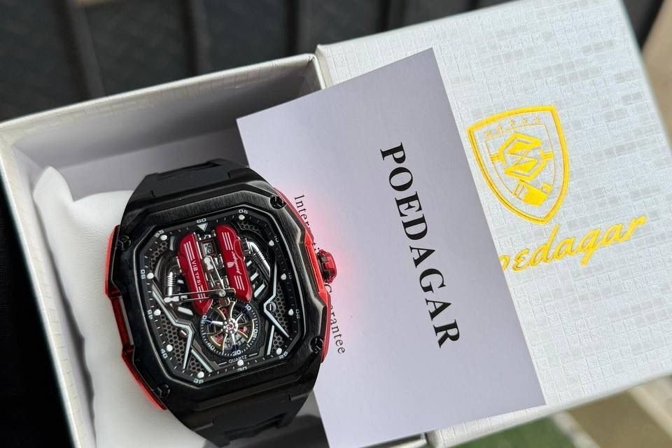 Poedagar automatic silicone watch featuring a stainless steel case, black dial, and durable silicone strap.