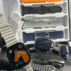 Smartwatch with smart sunglasses, interchangeable straps, USB‑C charging, built‑in speakers, and health‑tracking display.